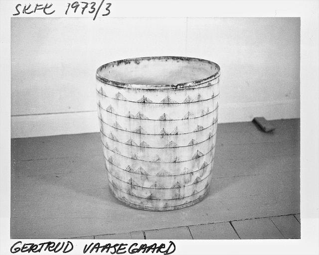 Grå, blå og sort cylinder